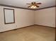 A bedroom featuring neutral carpet, a window with blinds, and a ceiling fan with lighting at 4187 Alaina Cir, Austell, GA 30106