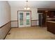 Dining area with access to back of house, carpeted and with vintage wall paper at 4187 Alaina Cir, Austell, GA 30106