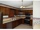 A well-lit kitchen featuring stainless steel appliances, ample counter space and vintage wall paper at 4187 Alaina Cir, Austell, GA 30106