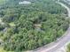Aerial view of a wooded lot, showcasing its proximity to a highway at 8035 Rockbridge Rd, Lithonia, GA 30058