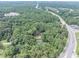 Lush lot surrounded by trees and near main thoroughfare, offers a private setting at 8035 Rockbridge Rd, Lithonia, GA 30058