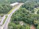 Aerial view of parcel on wooded lot offers proximity to highway, shopping, and dining at 8035 Rockbridge Rd, Lithonia, GA 30058