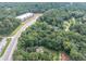 Aerial view of tree-lined parcel close to major highway offers serene living at 8035 Rockbridge Rd, Lithonia, GA 30058