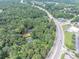 Wooded lot next to the main thoroughfare, offers a very convenient location at 8035 Rockbridge Rd, Lithonia, GA 30058