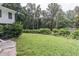 Large grassy backyard with trees at 8035 Rockbridge Rd, Lithonia, GA 30058