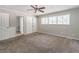 Spacious bedroom featuring natural light, neutral paint, and carpet at 8035 Rockbridge Rd, Lithonia, GA 30058