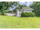 Home exterior with a large front yard at 8035 Rockbridge Rd, Lithonia, GA 30058