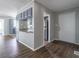 Open concept interior showcasing stylish flooring, modern gray walls, and granite countertops at 8035 Rockbridge Rd, Lithonia, GA 30058