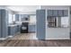 Well-lit kitchen featuring grey cabinets, modern appliances, and granite countertops at 8035 Rockbridge Rd, Lithonia, GA 30058
