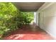 Side brick patio underneath a metal roof at 8035 Rockbridge Rd, Lithonia, GA 30058