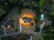 Aerial view showcases a well-manicured property with a large home, lush landscaping, and inviting swimming pool at 1310 Settles Rd, Suwanee, GA 30024