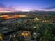 Large, well-maintained backyard with lush green lawn and mature trees offering a serene outdoor space at 1310 Settles Rd, Suwanee, GA 30024