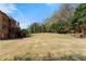 Spacious backyard with lush green grass and a view of the home at 1310 Settles Rd, Suwanee, GA 30024