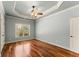 Spacious bedroom with hardwood floors, ceiling fan, and natural light from the window at 1310 Settles Rd, Suwanee, GA 30024
