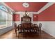 Formal dining room with elegant chandelier, wainscoting, and classic furnishings at 1310 Settles Rd, Suwanee, GA 30024