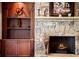 Detailed shot of a stone fireplace with custom built-ins and decorative accents for an elegant touch at 1310 Settles Rd, Suwanee, GA 30024