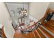 Elegant foyer with staircase, chandelier, decorative windows, and tile flooring at 1310 Settles Rd, Suwanee, GA 30024