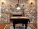 Billiard room with stone fireplace and decorative sconces offers a perfect spot for relaxation at 1310 Settles Rd, Suwanee, GA 30024