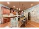 Gourmet kitchen with stone island, bar seating and custom cabinetry at 1310 Settles Rd, Suwanee, GA 30024