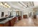 Spacious main bathroom with dual vanities, granite countertops, and a tiled floor at 1310 Settles Rd, Suwanee, GA 30024