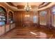 Wood-paneled office with custom built-ins, hardwood floors, and natural light at 1310 Settles Rd, Suwanee, GA 30024