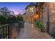 Spacious brick patio with wrought iron railing and outdoor seating, perfect for entertaining guests at 1310 Settles Rd, Suwanee, GA 30024