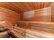 Home sauna with multi-tiered seating and wood paneled walls at 1310 Settles Rd, Suwanee, GA 30024