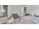 Cozy bedroom featuring an area rug, a desk, and closet space at 222 Winonna Dr, Decatur, GA 30030