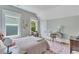 Bedroom featuring a desk, rug, windows, and neutral-colored walls at 222 Winonna Dr, Decatur, GA 30030