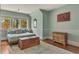Bedroom featuring an area rug, wall art, a chest, and lots of natural light at 222 Winonna Dr, Decatur, GA 30030