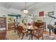 Bright dining room with a large wooden table, hardwood floors, and decorative rug creates an inviting space at 222 Winonna Dr, Decatur, GA 30030