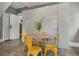 Eat-in kitchen features a retro table and chairs with a wall of integrated storage at 222 Winonna Dr, Decatur, GA 30030