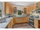 Well-lit kitchen featuring modern appliances, light wood cabinetry, and sleek countertops for a functional cooking space at 222 Winonna Dr, Decatur, GA 30030