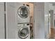 Convenient laundry area with a stacked washer and dryer, maximizing space and functionality at 222 Winonna Dr, Decatur, GA 30030