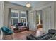 Comfortable living room with a blue accent wall, a large sofa, and natural light from several windows at 222 Winonna Dr, Decatur, GA 30030