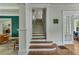 Elegant staircase with white trim and hardwood steps, leading to the upper level of the home at 222 Winonna Dr, Decatur, GA 30030