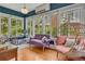 Cozy sunroom with ample windows and a comfortable seating area for relaxation and enjoying natural light at 222 Winonna Dr, Decatur, GA 30030