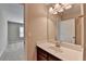 Bright bathroom featuring a sleek vanity, modern lighting, and a neutral color scheme at 4395 Wildbrooke Pkwy, Cumming, GA 30041