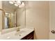Bathroom featuring a large mirror over a vanity with a sink and cabinets at 4395 Wildbrooke Pkwy, Cumming, GA 30041