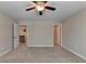 Bedroom with carpet, doors and ceiling fan at 4395 Wildbrooke Pkwy, Cumming, GA 30041