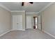 Bedroom featuring neutral carpet, closet, and open doorway to other rooms at 4395 Wildbrooke Pkwy, Cumming, GA 30041