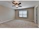 Bedroom with ceiling fan, carpet flooring, and natural light from the window at 4395 Wildbrooke Pkwy, Cumming, GA 30041