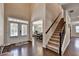 Inviting foyer features hardwood floors, a staircase, and views into the adjacent dining room at 4395 Wildbrooke Pkwy, Cumming, GA 30041