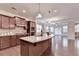 Spacious kitchen with granite countertops, stainless appliances, and a large center island at 4395 Wildbrooke Pkwy, Cumming, GA 30041