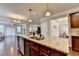 Granite countertop island is the centerpiece of this kitchen in a modern home at 4395 Wildbrooke Pkwy, Cumming, GA 30041