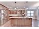 Well-equipped kitchen featuring stainless steel appliances and a granite island at 4395 Wildbrooke Pkwy, Cumming, GA 30041