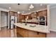 Lovely kitchen with granite countertops, stainless steel appliances and rich wood cabinets at 4395 Wildbrooke Pkwy, Cumming, GA 30041