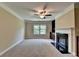 Comfortable living room with fireplace and built-in bookshelves at 4395 Wildbrooke Pkwy, Cumming, GA 30041