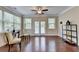 Sun-filled living area with hardwood floors, large windows, and neutral decor at 4395 Wildbrooke Pkwy, Cumming, GA 30041
