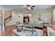 Open-concept living room showcases hardwood floors, neutral paint colors, and a cozy seating area at 4395 Wildbrooke Pkwy, Cumming, GA 30041